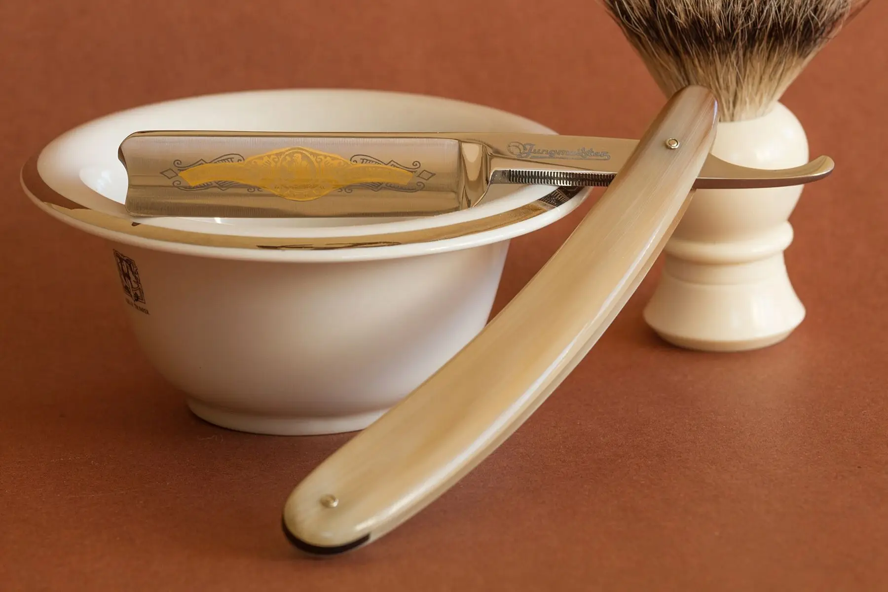 Razor, badger brush and shaving bowl